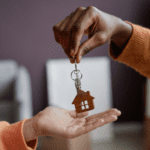 House key being passed between two people