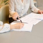 People working through documents