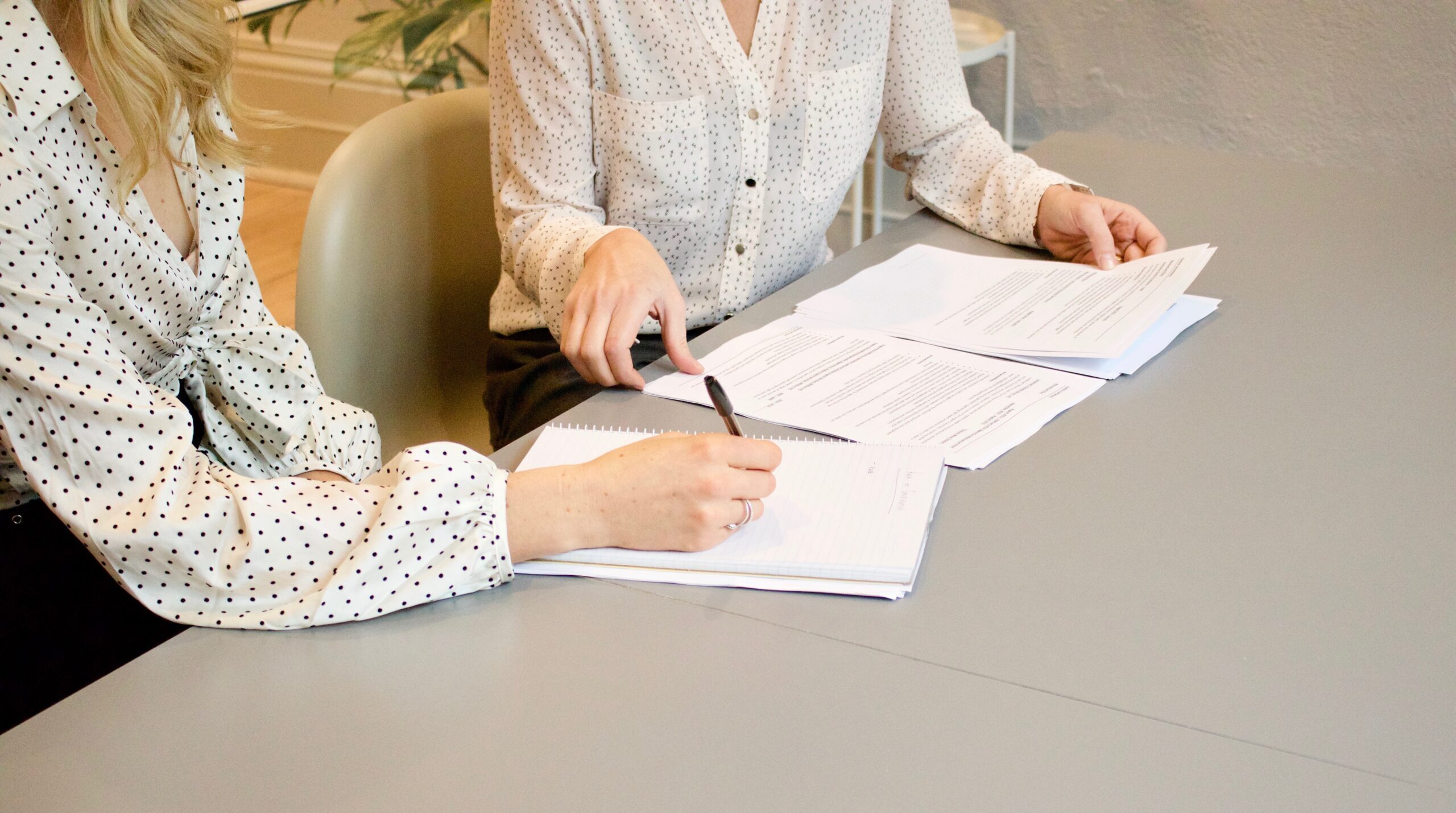 People working through documents