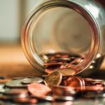 Coins falling out of jar