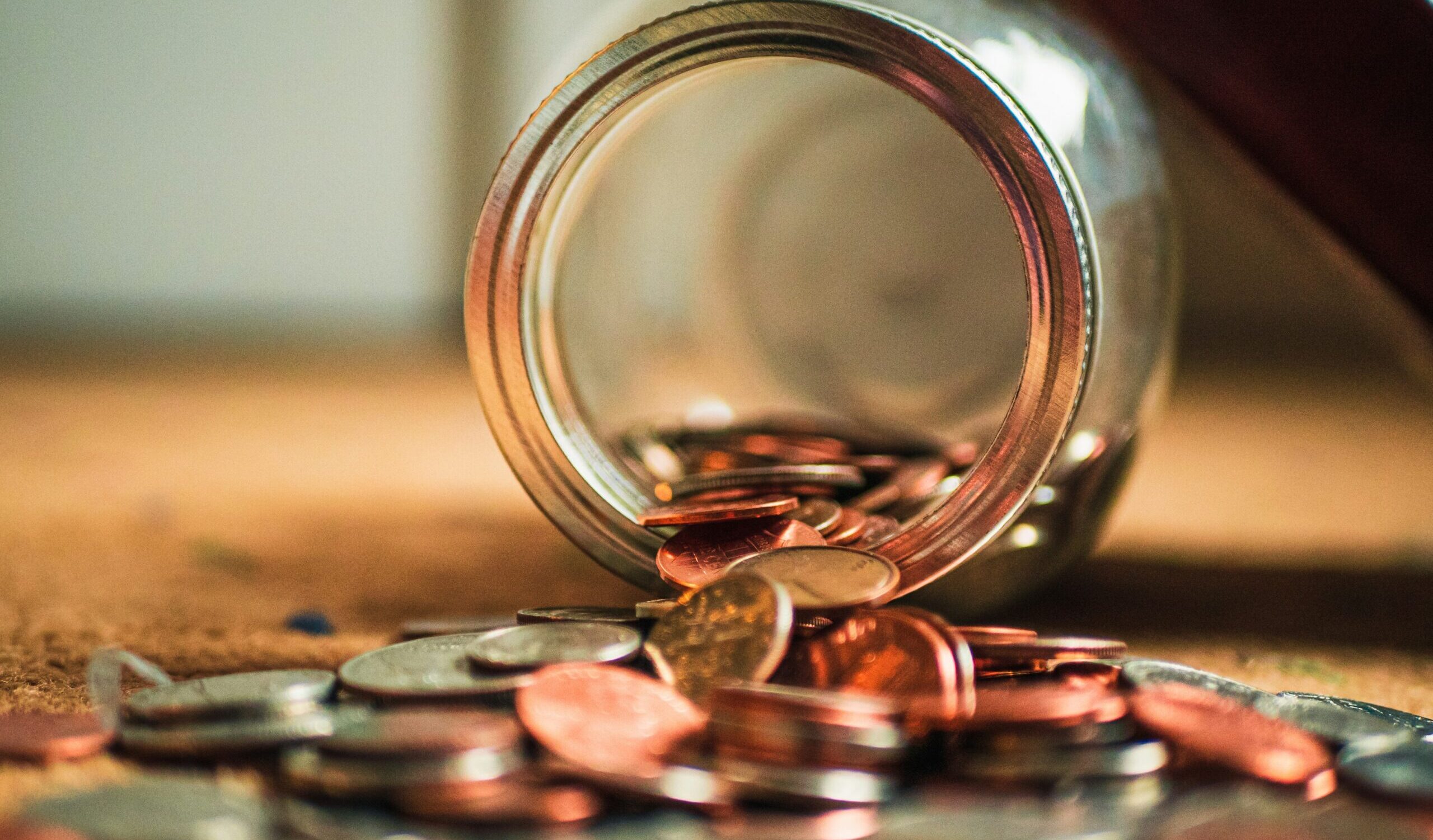 Coins falling out of jar