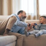 older man and child at home