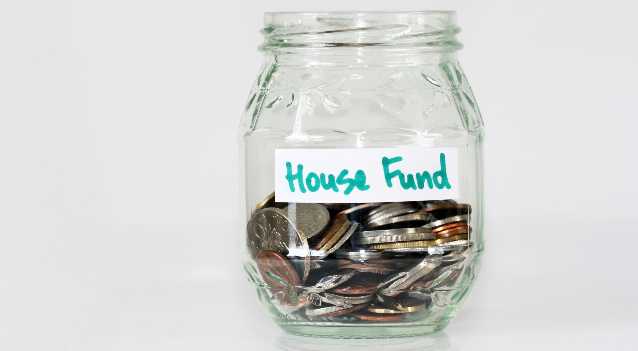 House fund coins in a jar