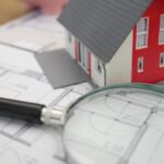 Magnifying glass on house plans searches