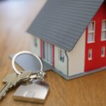 Small toy house with keys next to it